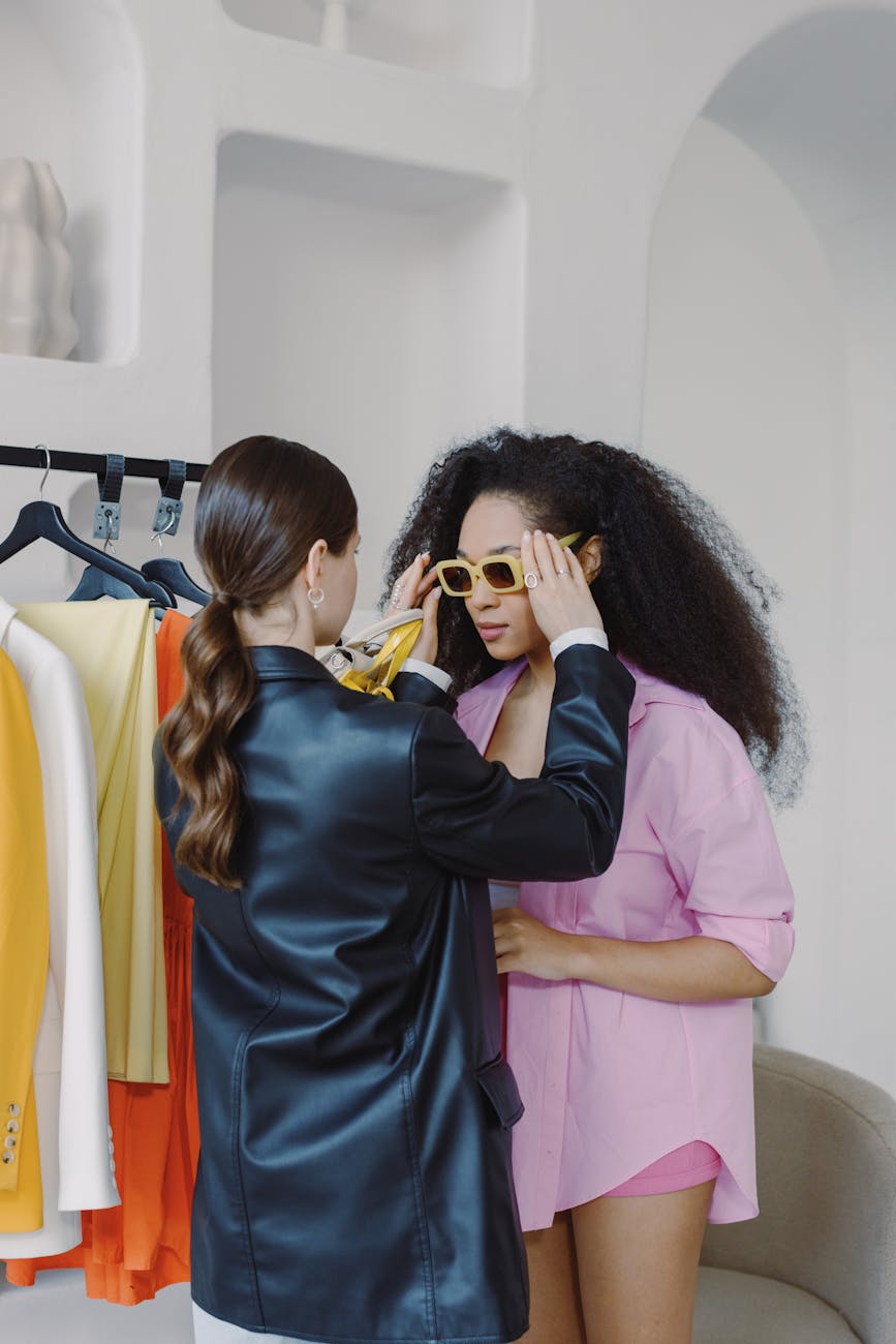 a personal stylist dressing up a woman
